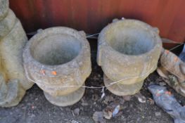 A PAIR OF MODERN CONCRETE GARDEN URNS, with grape and vine detail, and a geometric top rim, height