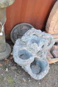 A MODERN CONCRETE GARDEN WATER FEATURE, in the form of three cascading bowls, with floral detail and