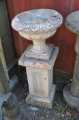 A MODERN CONCRETE GARDEN URN ON STAND, with a fluted balustered bowl atop a rectangular column,
