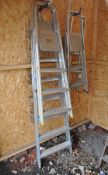A COLLECTION OF FOUR ALUMINIUM STEP LADDERS, the largest being 210cm high, a Wickes rammer and an