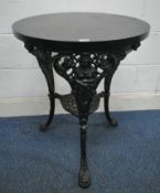 A BLACK PAINTED CAST IRON PUB TABLE, with a stained oak surface, raised on shaped legs with human