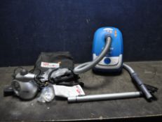 A HOOVER WHIRLWIND VACUUM CLEANER, with no floorhead and a Monster Baby steamer (both PAT pass and