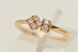 A YELLOW METAL AND DIAMOND RING, designed as an abstract cluster of six round brilliant cut