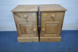 AN OPPOSING PAIR OF PINE BEDSIDE CABINETS, with one drawer and cupboard door, width 41cm x depth