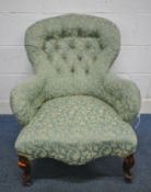 A VICTORIAN BUTTON BALLOON BACK ARMCHAIR, with scrolled armrests, serpentine fronted seat, raised on