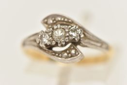 A THREE STONE DIAMOND RING, three single cut diamonds, prong set in a white metal bypass setting,