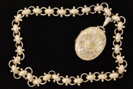A SILVER LOCKET AND WHITE METAL BOOK CHAIN, a large oval embossed locket with ivy and button detail,