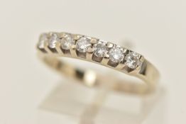 AN 18CT GOLD DIAMOND RING, seven round brilliant cut diamonds prong set in white gold, approximate