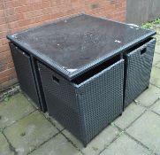 A RATTAN EFFECT GARDEN TABLE AND FOUR INTEGRATED CHAIRS, table top is 110cm square, with a glass