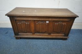 AN EARLY 20TH CENTURY OAK BLANKET CHEST, with three linenfold panels, width 95cm x depth 38cm x