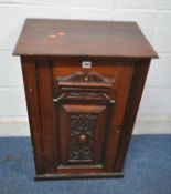 AN EARLY 20TH CENTURY MAHOGANY SINGLE DOOR CABINET, the door with repeating scrolled patterns, width