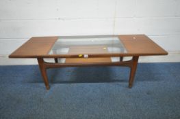 G PLAN, A MID CENTURY 'LONG JOHN' TEAK RECTANGULAR COFFEE TABLE, with a glass insert, raised on