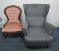 A GREY UPHOLSTERED WINGBACK ARMCHAIR, width 82cm x depth 100cm x height 100cm, along with a