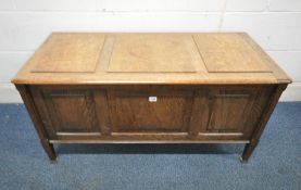 AN EARLY 20TH CENTURY OAK BLANKET CHEST, with a hidden secret drawer to the underside, raised on
