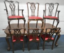 AN EDWARDIAN MAHOGANY WIND OUT DINING TABLE, with two additional leaves, raised on cabriole legs,