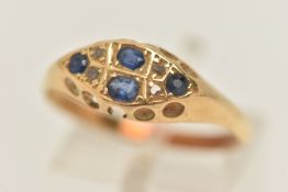 AN EARLY 20TH CENTURY GEM SET RING, four sapphires and four rose cut diamonds, prong set in yellow