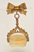 A YELLOW METAL SWIVEL CITRINE FOB WITH BOW BROOCH, oval Citrine fitted with a yellow metal ivy