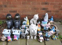 A LARGE COLLECTION OF GARDEN ORNAMENTS, including elephant stands, pagodas, gnomes, dog figures, etc
