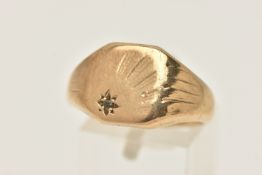 A GENTS 9CT SIGNET RING, sun burst design with a star set single cut diamond, textured shoulders and