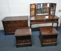STAG MINSTREL, A FIVE PIECE BEDROOM SUITE, comprising a dressing table, with a triple dressing