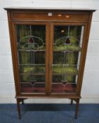 A EDWARDIAN MAHOGANY DISPLAY CABINET, the double lead glazed doors, with stained glass segments,