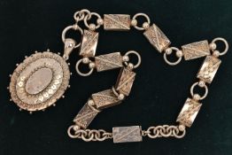 A LATE 19TH CENTURY WHITE METAL LOCKET AND BOOK CHAIN, a large oval locket with central etched heron