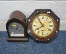 A 20TH CENTURY OCTAGONAL WALL CLOCK, the convex glass door enclosing a 9 inch enamel dial, depicting