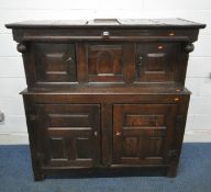 AN 18TH CENTURY WELSH OAK TRIDARN, the top with double cupboard doors, flanking an arched central