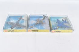 THREE BOXED CORGI AIRCRAFTS, the first a North American P-51D Mustang, reference 1306, faded to some