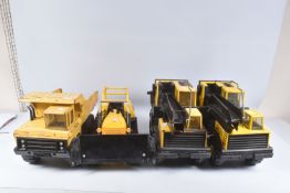 FOUR ITEMS OF MIGHTY TONKA TOYS CONSTRUCTION EQUIPMENT, a Bulldozer, 2 x Lorry/Truck mounted Grab
