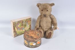 A GOLDEN PLUSH TEDDY BEAR, originally birthday is April 1957, amber and black glass eyes, shaved