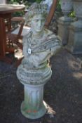 A WEATHERED COMPOSITE GARDEN BUST OF A ROMAN EMPEROR, on a circular stepped base, raised on a