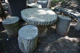 A WEATHERED COMPOSITE TREE STUMP EFFECT GARDEN TABLE, on a central support, diameter 78cm x height