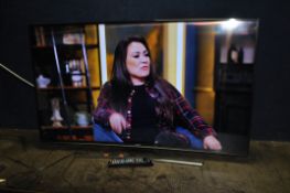 A SAMSUNG UE55JU6500 55in CURVED SCREEN Smart TV with remote (but not correct for TV but works apart