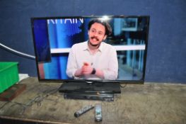 A SAMSUNG UE42F5000 42in TV with remote and a Panasonic DVD/HDD recorder and remote (both PAT pass