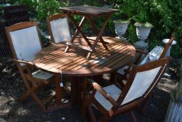 A ROYAL CRAFT TEAK GARDEN PATIO SET, to include an oval gate leg table, open measurements 150cm x
