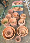A LARGE COLLECTION OF MOSTLY MODERN TERRACOTTA PLANT POTS, of varying sizes (100+)