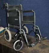 A ROMA MEDICAL FOLDING WHEELCHAIR, with two footrests