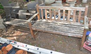 TWO HEAVILY WEATHERED GARDEN BENCHES, one with cast iron ends, the other hardwood constructed (2)