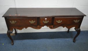 A REPRODUCTION GEORGIAN STYLE MAHOGANY DRESSER BASE, fitted with three drawers, raised on cabriole