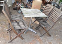 A CHROME METAL AND HARDWOOD BISTRO TABLE, and a set of four folding hardwood garden chairs (5)