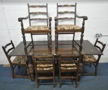 STANLEY WOOD OF OLNEY, BUCKINGHAMSHIRE, A 20TH CENTURY OAK DRAW LEAF DINING TABLE, raised on bulbous