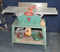 A KITY 636 PLANER THICKNESSER, with a 110cm bed length (PAT fail due to uninsulated plug and taped