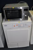 A MIELE T230C CONDENSER DRYER, width 60cm, depth 60cm, height 85cm, and a Daewoo microwave (both PAT