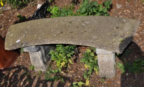 A CONCRETE GARDEN BENCH, with a curved seat and scrolled bases, length 128cm, Condition Report: