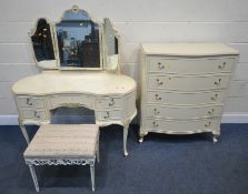 A CREAM FRENCH TWO PIECE BEDROOM SUITE, comprising a kidney dressing table, with a triple dressing