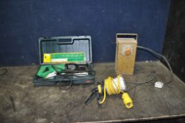 A CASED HITACHI CR12V 110V RECIPROCATING SAW, with a 110v lead light, and a vintage 110v transformer