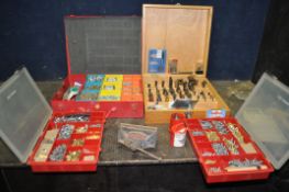 A BESPOKE WOODEN CABINET CONTAINING ROUTER BITS AND MOULDING CUTTERS, along with three trays