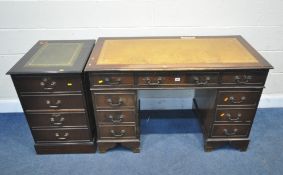 A 20TH CENTURY MAHOGANY TWIN PEDESTAL DESK, with a tanned leather writing surface, and eight
