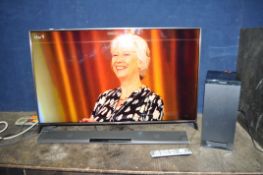 A PANASONIC TX 50CX802B 50in SMART TV, with remote, a Panasonic SU-HTB485 soundbar and sub woofer (